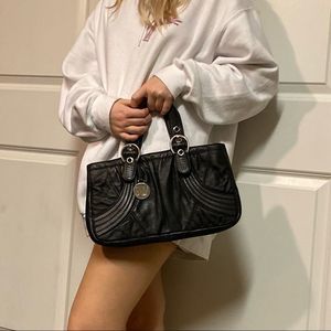 Stuart Weitzman black pebbled leather armpit small pouchette purse bag contrast